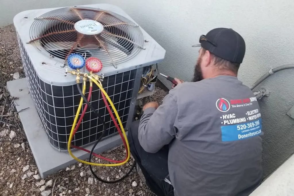 Done Rite Services HVAC expert repairing air conditioner in residential property in Tucson, AZ