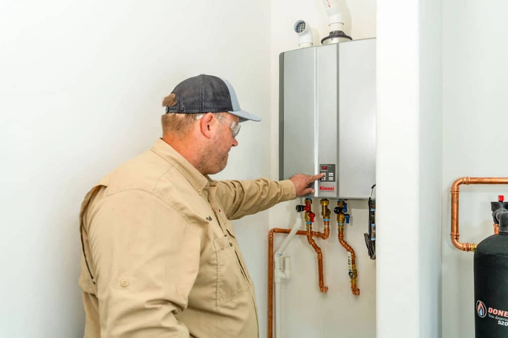 image of a tankless water heater installation being installed by Done Rite Services
