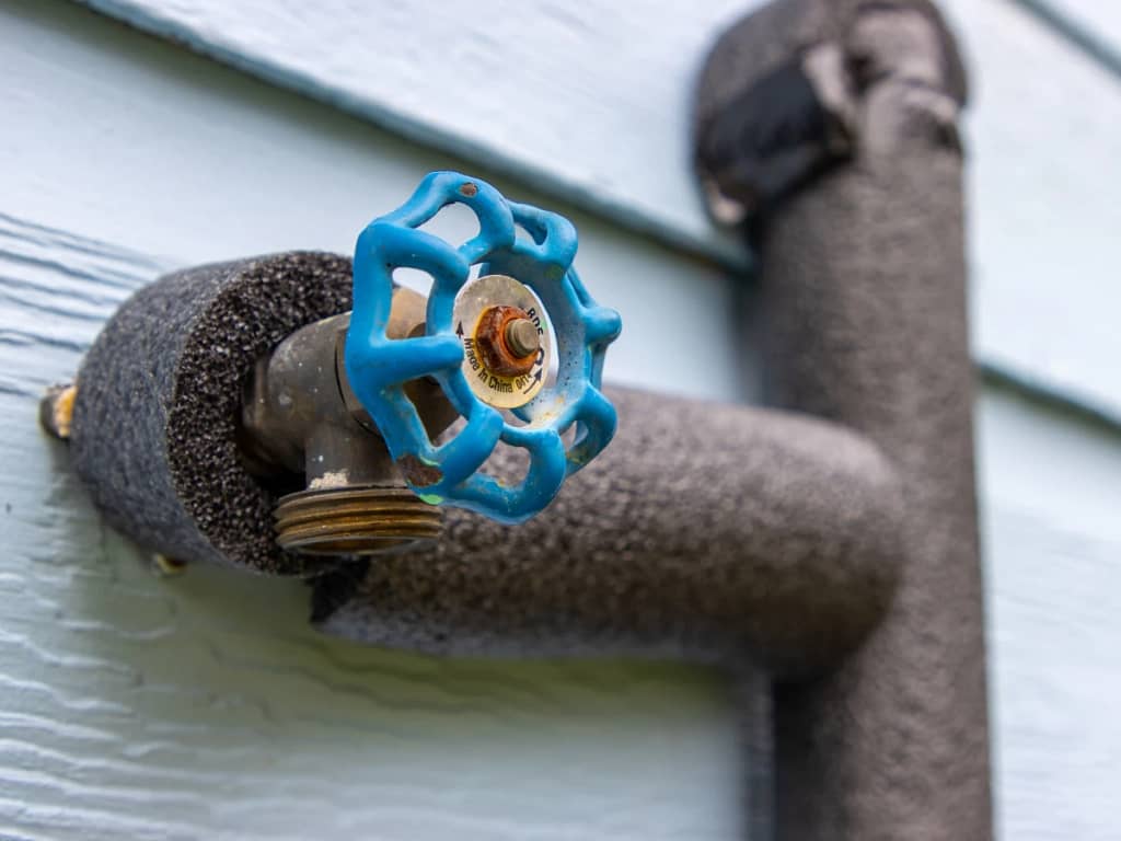 image of a water valve with protective pipe insulation - a preventive measure for pipe burst
