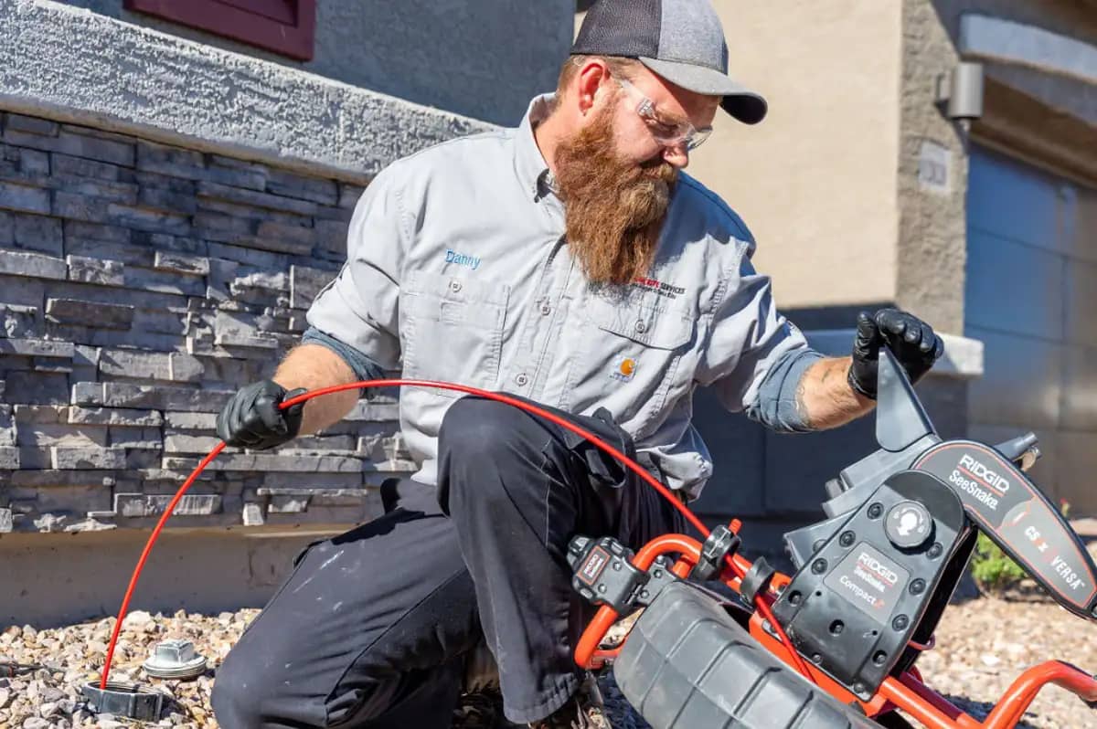 Done Rite Services expert plumber uses high-tech equipment to unblock an exterior drain, effectively removing blockages caused by mud and organic matter. The service restores proper drainage, protecting properties from water damage.