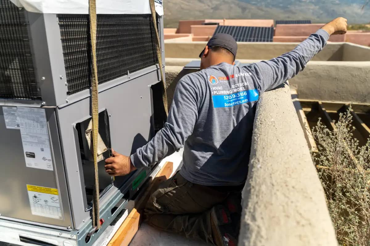 Image of our Professional HVAC doing commercial air conditioner installation in Tucson
