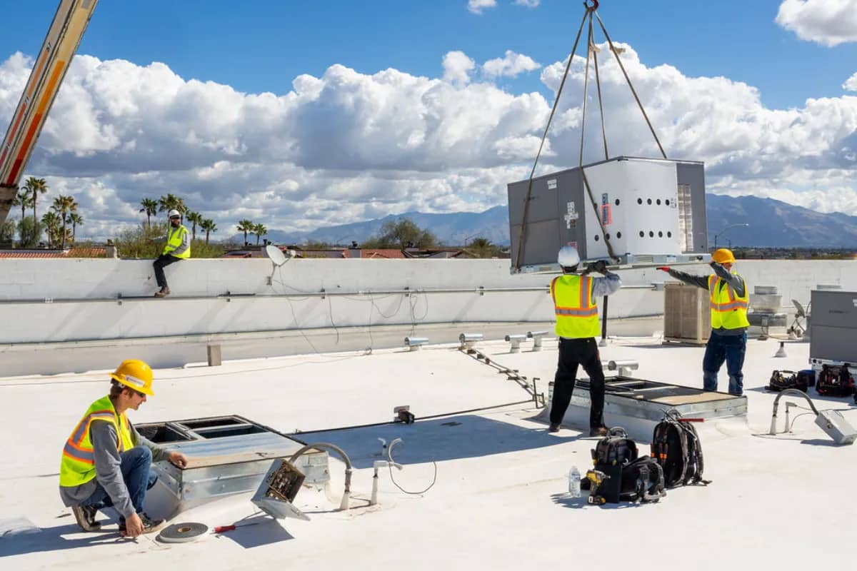 Done Rite technician on the rooftop for AC installation in Tucson