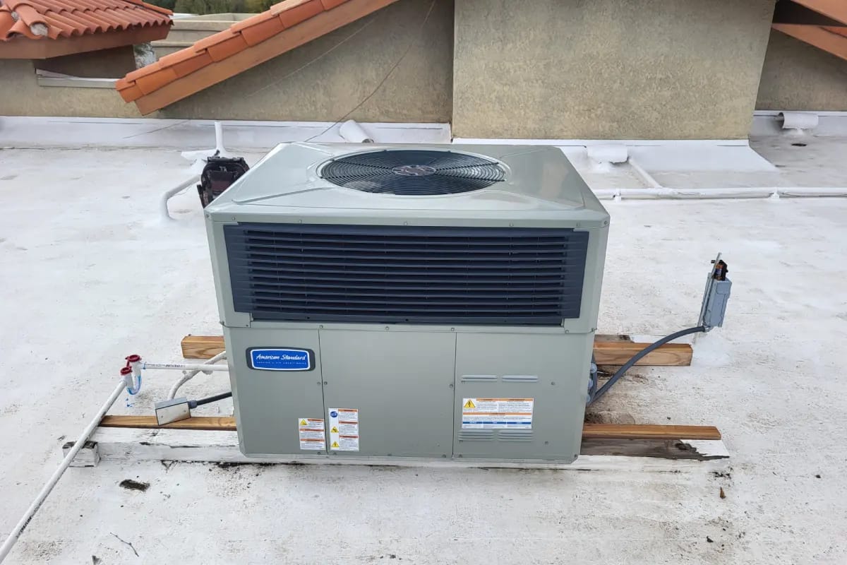 Professional AC installation on a residential rooftop by Done Rite Services, optimized for superior cooling.