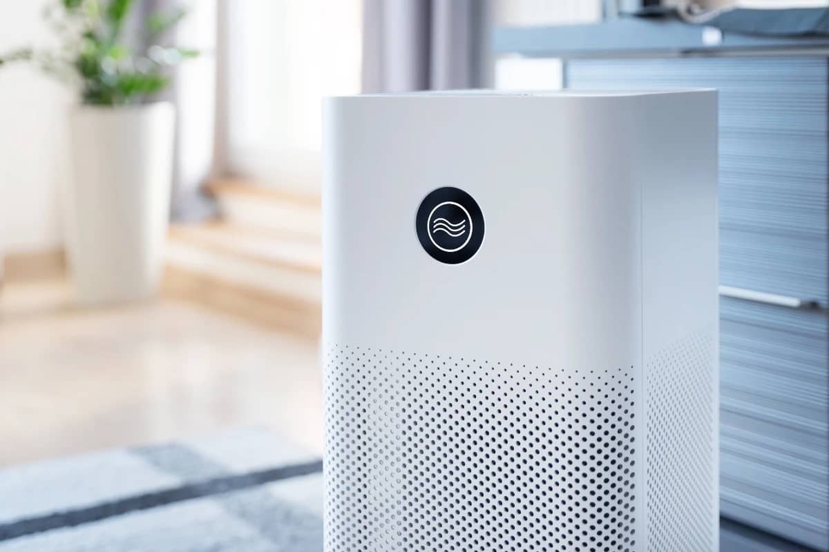 Compact air purifier in a living room, showcasing its design and fit for home air quality improvement.
