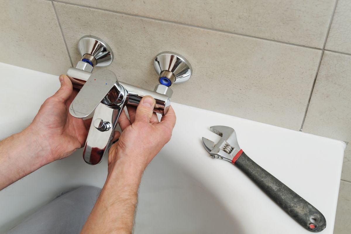 Done Rite Services providing fast and effective repair of a leaky bathtub faucet in a Tucson home.