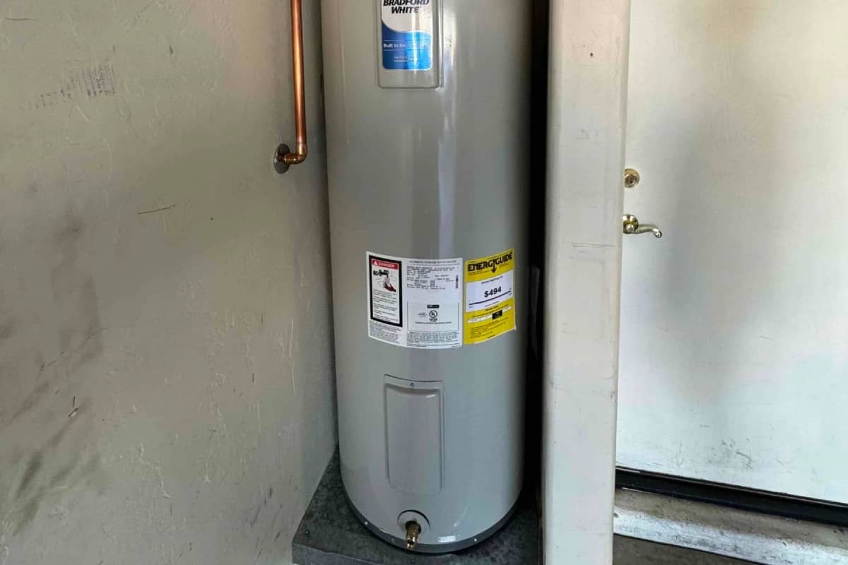 Done Rite Service technicians swiftly repairing a hot water heater in an emergency, ensuring rapid restoration of hot water.