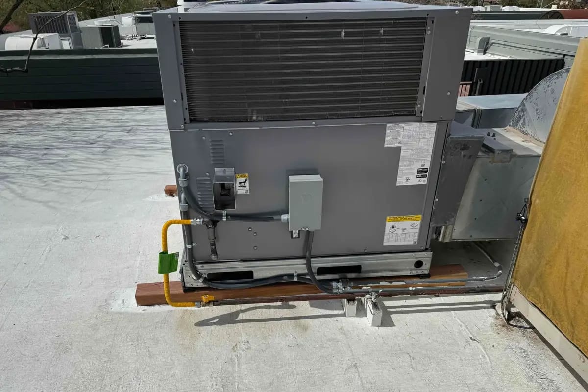 Gas heating system installation by Done Rite Services on a commercial rooftop, providing warmth and efficiency to the entire building.