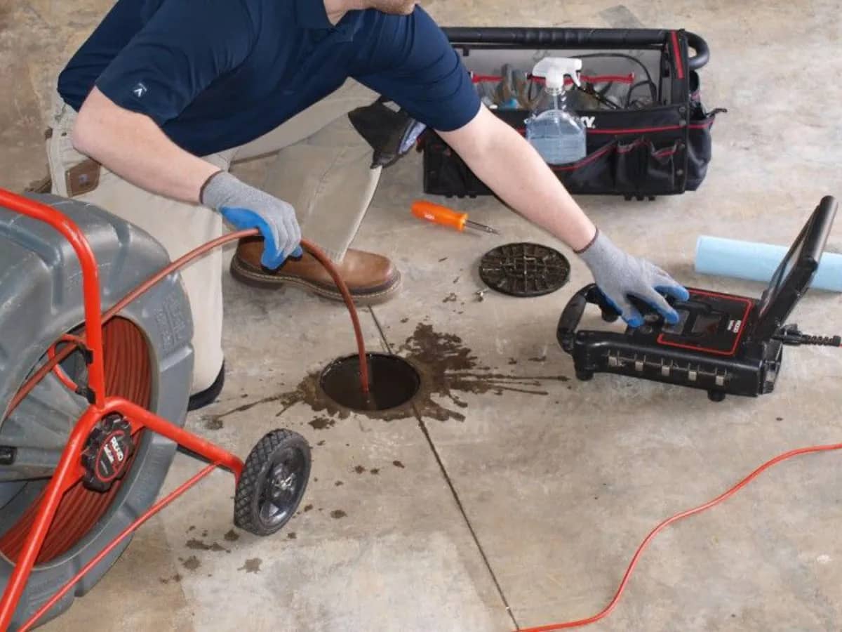 Done Rite professional plumber conducting routine drain cleaning service in Tucson, AZ, ensuring optimal plumbing performance