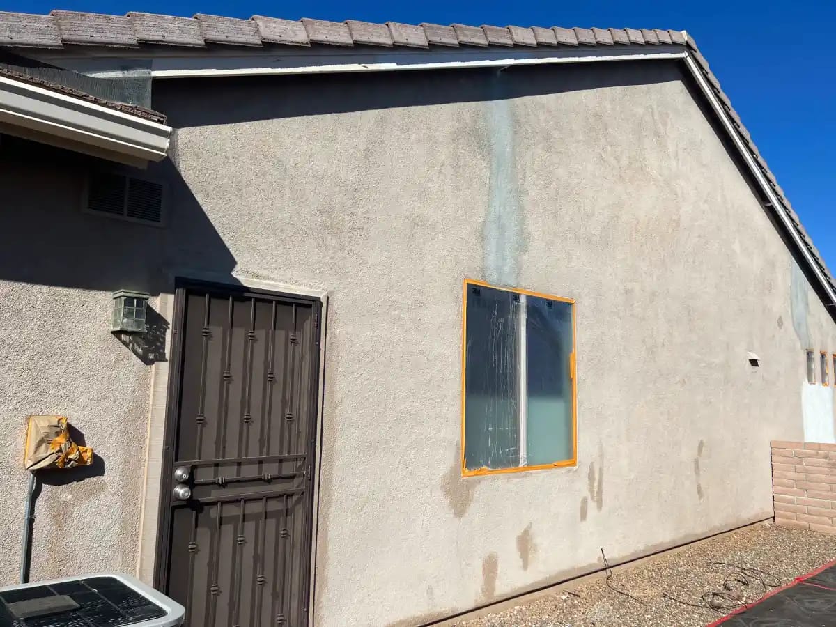 Cracked stucco wall of a residential property in tucson, az undergoing stucco repair