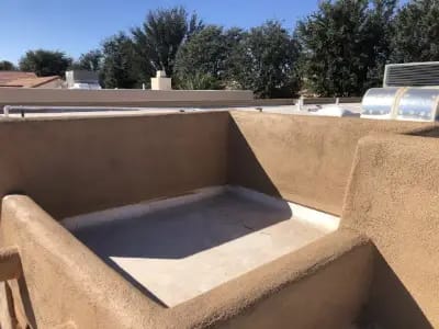 Image of a stucco roof parapet after the stucco restoration